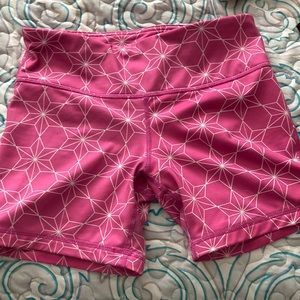 Pink athletic shorts.